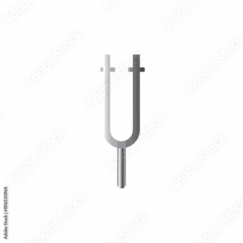 Close-up of a metallic tuning fork with a smooth transition from light to dark on a white background.