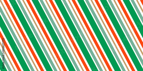 Seamless pattern of Christmas candy canes. Christmas candy cane background with red and green stripes. Christmas wrapping paper.