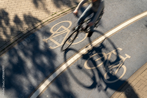 Top View of a Bicycle Road. Blue Bike Lane With the Bicycles passing on the white symbol of a bike in Konstanz, Germany.