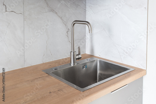 kitchen faucet on a stylish metal sink