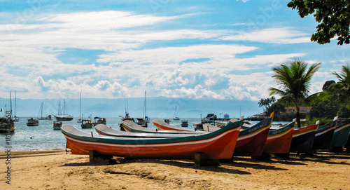 Colorful Canoes on a Sunny Tropical Beach in Ilhabela, Brazil