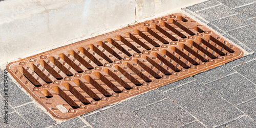 Metal Storm Drain Grate on Asphalt Road