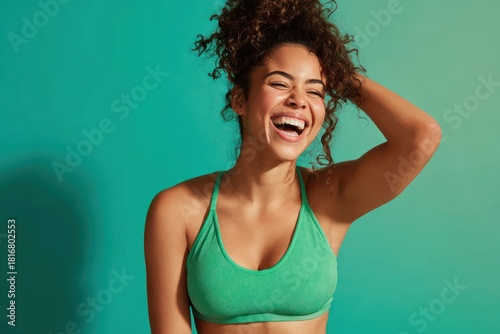 Laughing Woman in Green Sports Bra, Studio Shot