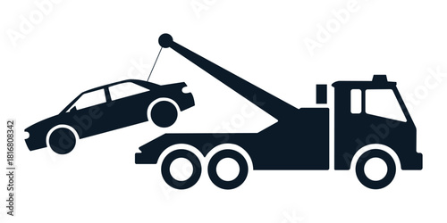 Dark blue tow truck lifting a car towing vehicle