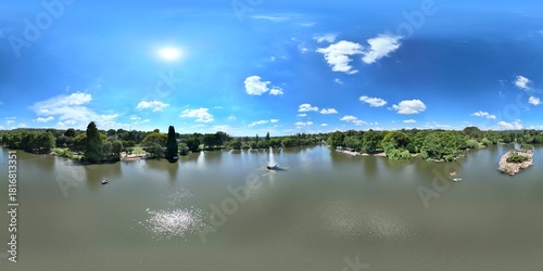 360 aerial photo taken with drone of fountain and bird sanctuary at Zoo Lake on sunny day in Johannesburg, South Africa