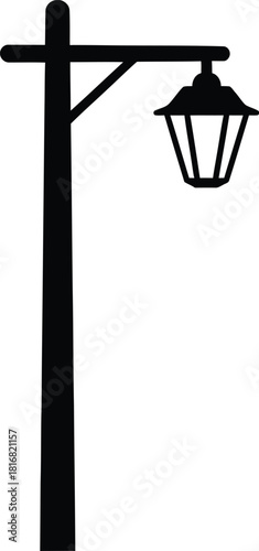 A classic black silhouette of a vintage street lamp post with a hexagonal lantern isolated on a clean white background representing outdoor lighting and historical ambiance