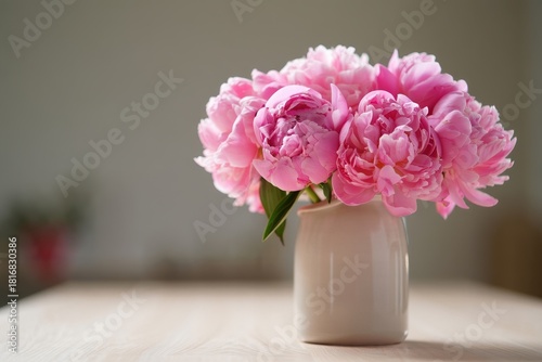 Wallpaper Mural Pink peonies in a minimalist ceramic vase on a pale ivory marble desk. Torontodigital.ca