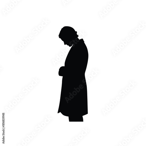 Man in a long coat looking down silhouette