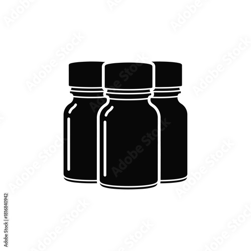 Three dark glass bottles silhouette