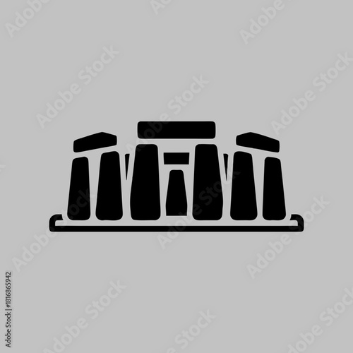 Black silhouette icon of Stonehenge, the prehistoric monument in Wiltshire, England, against a solid grey background.