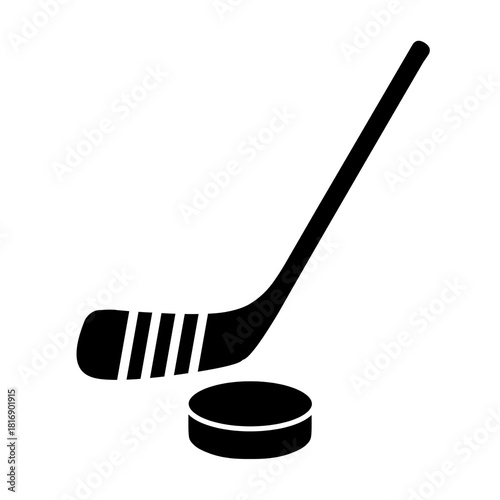 Hockey stick and puck vector icon illustration in silhouette style