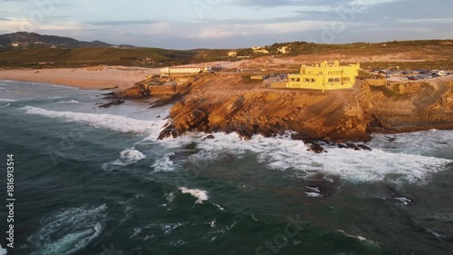 stunning highangle shot capturing seaside home amidst wild ocean waves and rocky formations