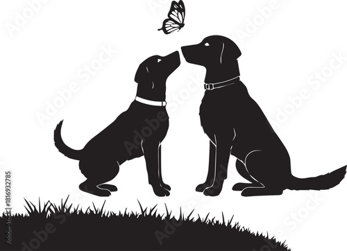 Two black labrador puppies sharing a tender moment with a butterfly above