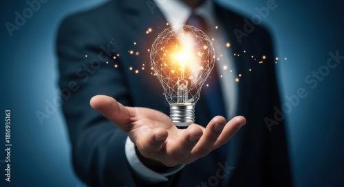 A businessman in a suit holds a glowing light bulb with a futuristic polygonal network, symbolizing innovation, creative ideas, and technological solutions for business