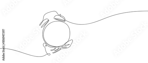 Hand holding an alarm clock in one continuous line. one line vector illustration Editable stroke.