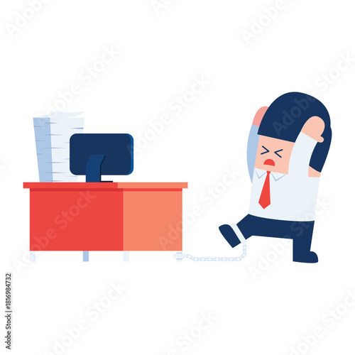 Businessman chained to desk with computer and papers
