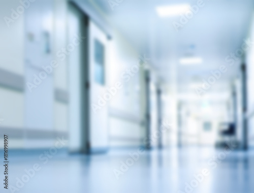 Blurred perspective of a sterile hospital corridor with doors and hallway