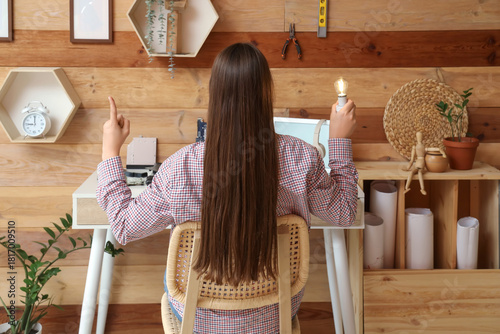 Female inventor with glowin...