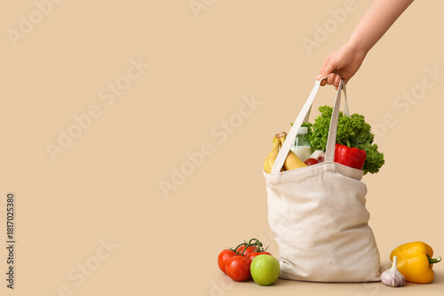 Female hand holding eco bag...