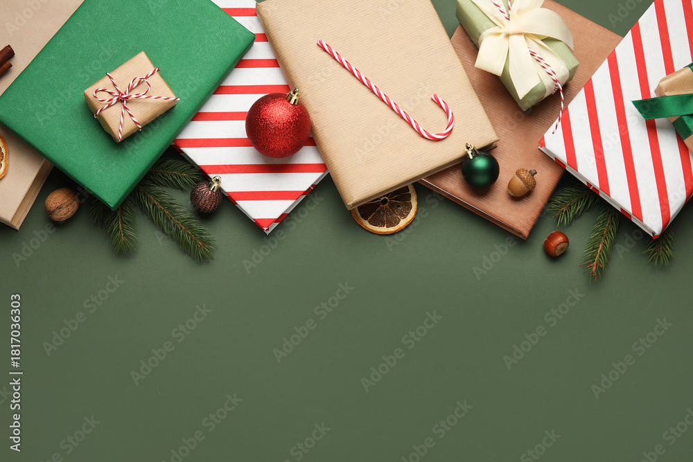 Obraz premium Books with Christmas balls, candy cane, gift boxes and fir branches on green background