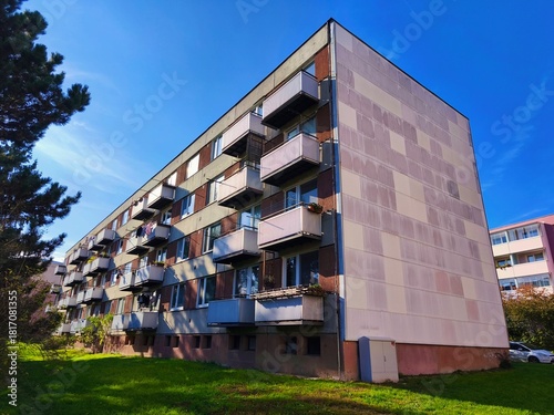 Original prefabricated houses on a housing estate from the communist era in Eastern Europe. old prefabricated building before renovation with windows and balconies. Czech Republic.