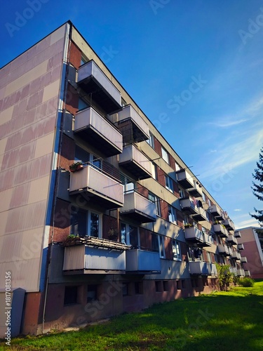 Original prefabricated houses on a housing estate from the communist era in Eastern Europe. old prefabricated building before renovation with windows and balconies. Czech Republic.