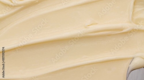 Moisturising creme swatch motion with spatula. Skin care light creamy cosmetic beauty product smudge closeup video. Cream texture footage. Skincare cosmetics sunscreen lotion mousse close up. 4k