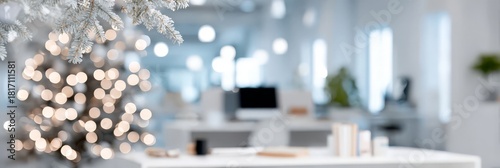 Modern office decorated for christmas with tree and lights in background