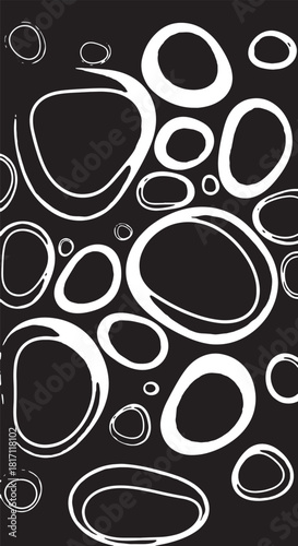 Abstract monochrome circular patterns on black background featuring interlocking rings.