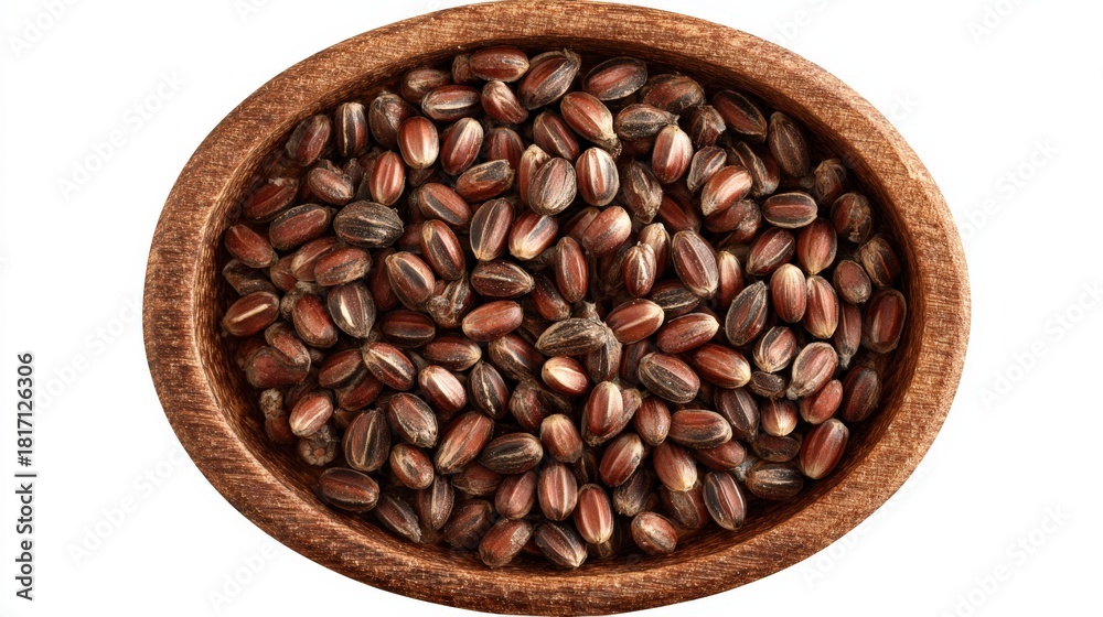 Fototapeta premium Dark colored grains fill a rustic wooden bowl seen from directly above on a white background.