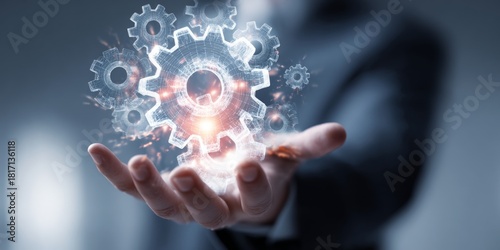Futuristic Technology Concept with Gears and Data Visualization in Hands of Business Person Against Abstract Background