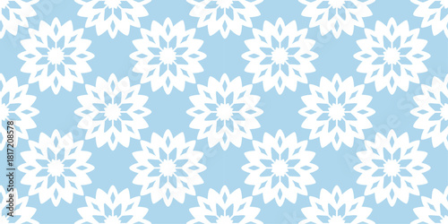 Seamless winter pattern with repeating snowflake shapes in soft icy tones. Geometric seasonal motif inspired by classic frosty themes. Festive background perfect for Christmas and New Year projects.