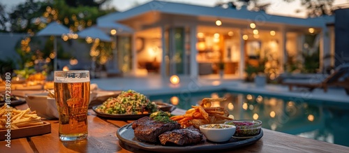 Relaxing Evening - Beer, Food, and Poolside Ambiance at Luxurious Villa.