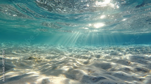 Fototapeta Naklejka Na Ścianę i Meble -  Crystal Clear Shallow Sea with Sun Rays on Sandy Floor