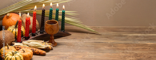 Kwanzaa Celebration Setup. A festive Kwanzaa display with candles, fruits, and decorative elements