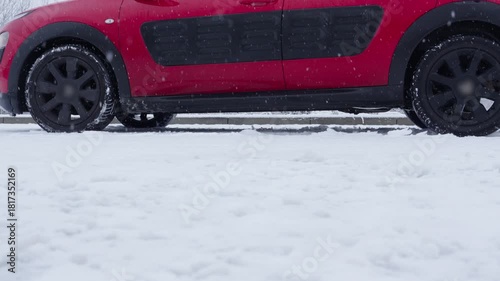 Car braking on icy slope with ABS engaging during winter road conditions
