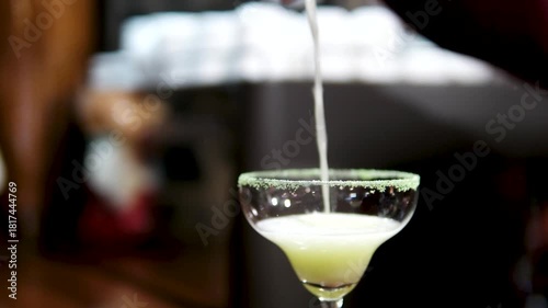 Hand serving margarita cocktail at Phuket beach bar setting. High quality 4k footage