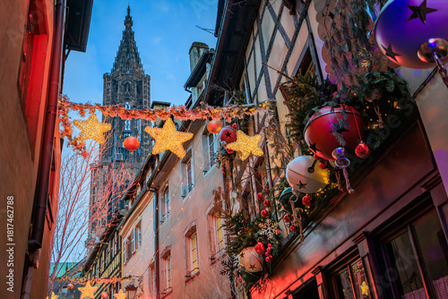 Lights illuminate half timbered houses, Christmas Market, Strasbourg, France,