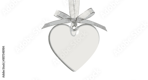 A clear heart shaped ornament with a silver ribbon hanging down on a white isolated background view