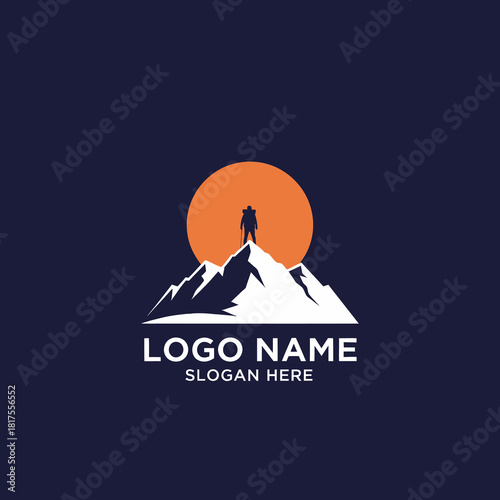 Silhouette of a hiker standing atop a snowy mountain peak against a large orange sun.