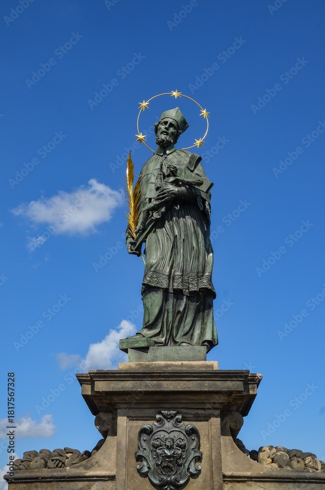 Obraz premium Czech Republic, Prague September 6, 2025 The statue of John of Nepomuk on the Charles Bridge in Prague