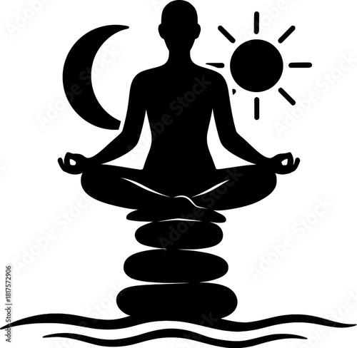 Silhouette of a person meditating on stacked stones under the sun and moon for balance
