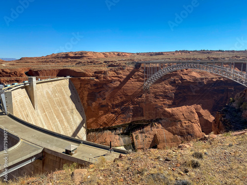Glen Canyon Dam and Bridge in Page, Arizona. A concrete arch-gravity dam built by the Bureau of Reclamation on the Colorado River forms Lake Powell within Glen Canyon National Recreation Area.