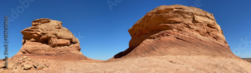 Beehive and New Wave trails in Glen Canyon National Recreation Area near Page, Arizona. Sandstone outcroppings, windswept rock formations, breathtaking views of desert landscape and distant mountains.