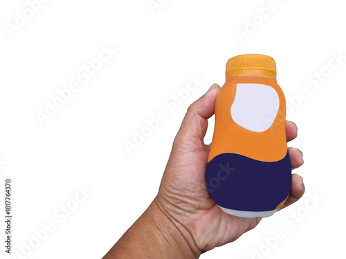 Hand holding small plastic bottle colorful label design. Bottle orange, blue, white sections, clean white background, packaging mockups, advertisements, and marketing materials. advertisement