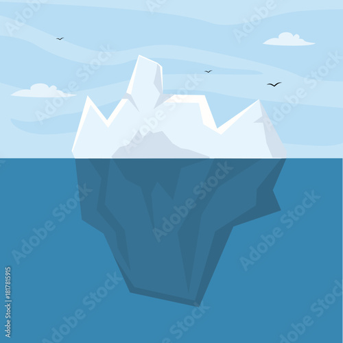 Floating arctic iceberg showing the visible peak above water and the massive structure beneath the ocean surface. Can be used for global warming and climate change theme