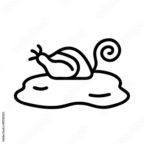 A snail is crawling through the mud isolated on