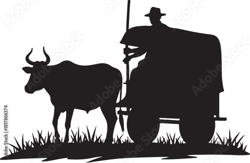 Black silhouette of a man driving a bull cart through grass
