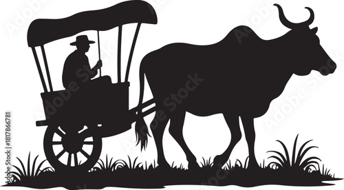 Black silhouette of a man driving a bullock cart ox cart
