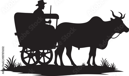 Silhouette of man driving ox cart through grass pulling